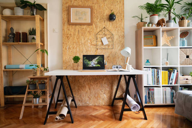 istock Creative workspace, laptop on a worktable in a cozy modern home office 1303366159