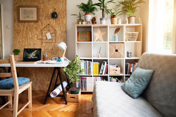 istock Modern cozy apartment with worktable and lots of personal accessories 1303366185