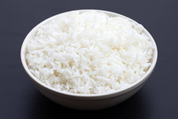 istock Dish of rice on white background. 1303366237