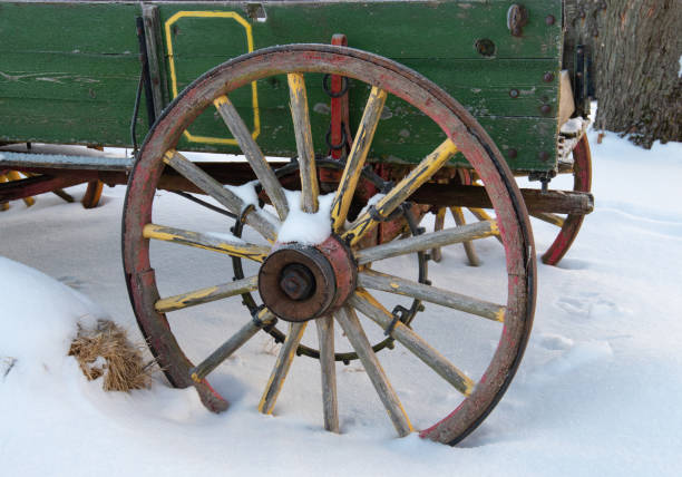 istock Old Wagon Wheel in the snow-Howard County, Indiana 1303367604