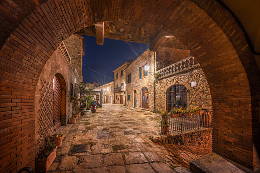 Casale Marittimo old village in Maremma. Picturesque central square, night view. Tuscany, Italy Europe.