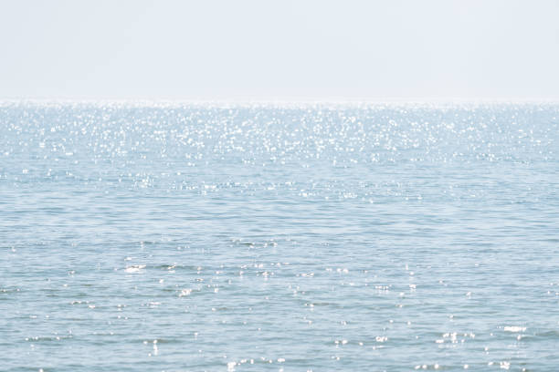 istock Minimalistic natural background with blue water 1303368815