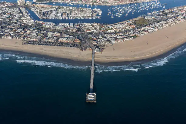 Aerial view of Newport Beach pier and harbor in Orange County, California.