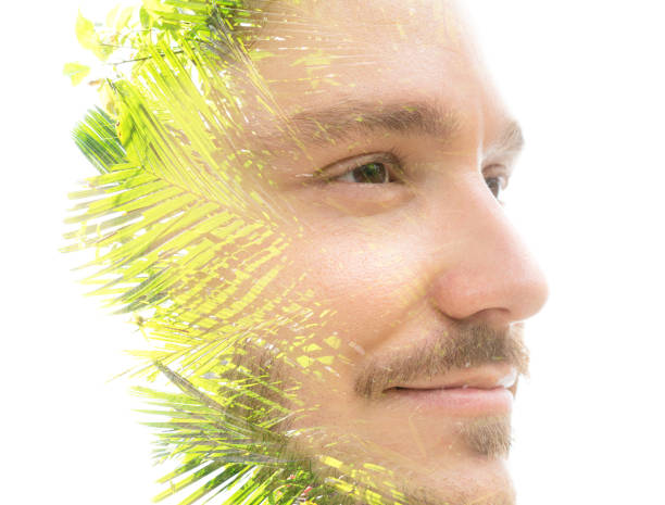 istock A man's portrait closeup with palm tree leaves in double exposure 1303377165