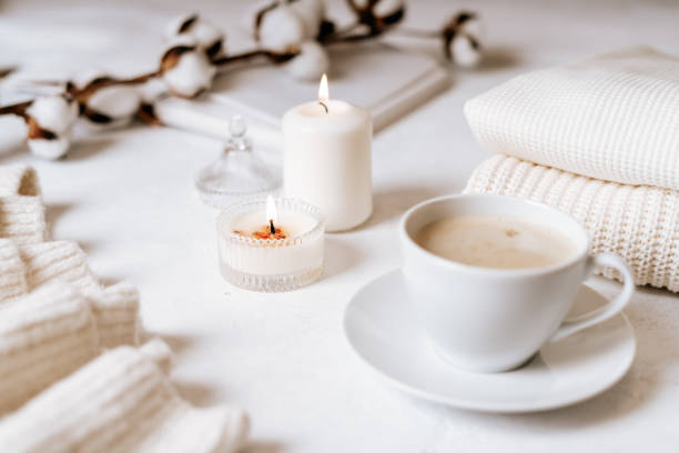 istock White cup of coffee, cotton, candles. 1303377170