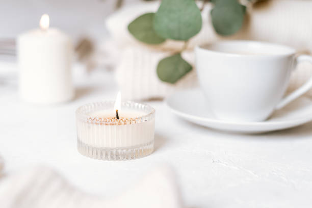 istock White cup of coffee, cotton, candles. 1303377188