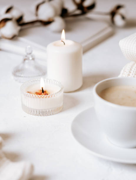 istock White cup of coffee, cotton, candles. 1303377364