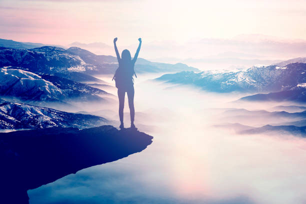 istock Woman Silhouette at sunset on hill 1303381166