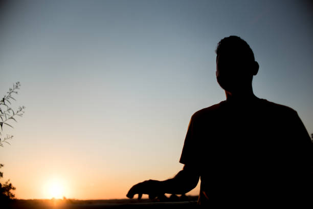 istock Silhouette of man in park 1303382417