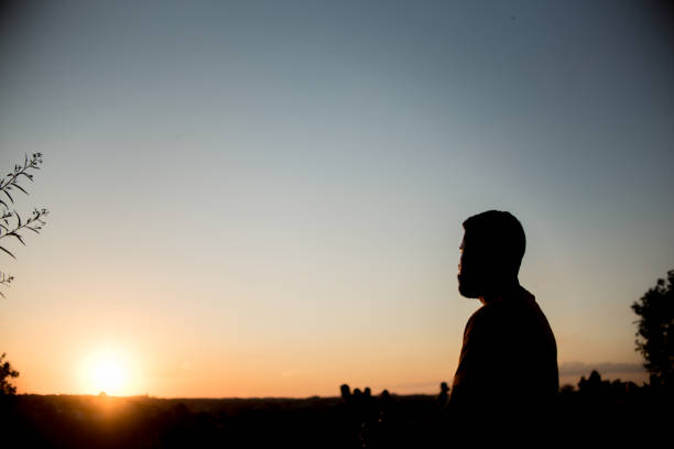 istock Silhouette of man in park 1303382418