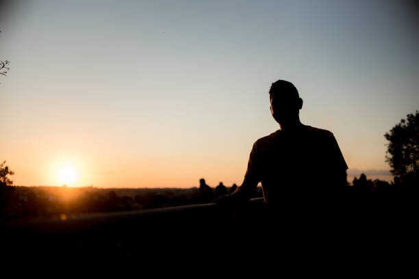 istock Silhouette of man in park 1303382420