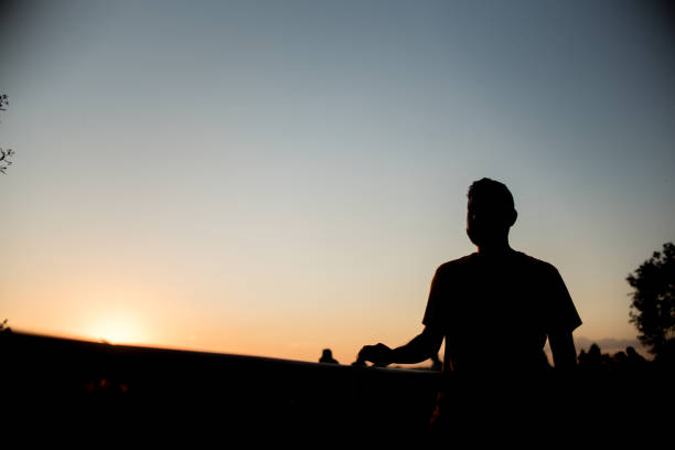 istock Silhouette of man in park 1303382423
