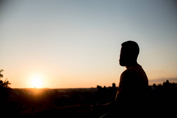 istock Silhouette of man in park 1303382719