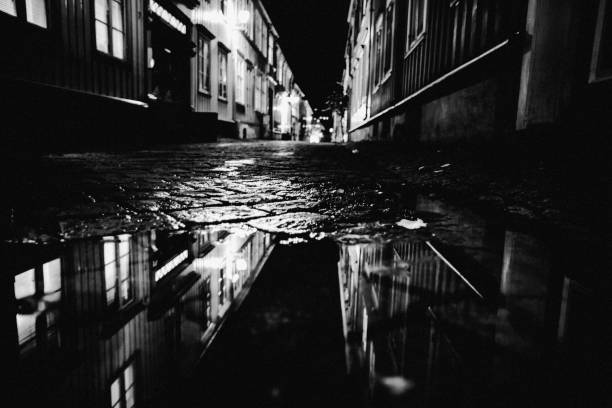 istock Dark street reflection - Trondheim, Norway 1303383632