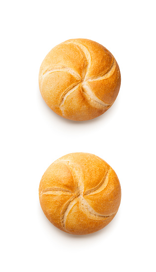 Baked bread rolls isolated on white background. Top view