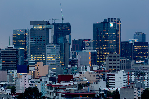 View of the city skyline at dusk in Mexico City, Mexico.