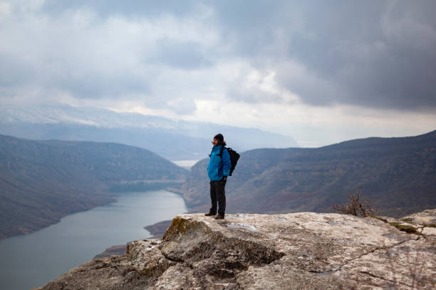 istock A man on top of a mountain looking at view 1303388711