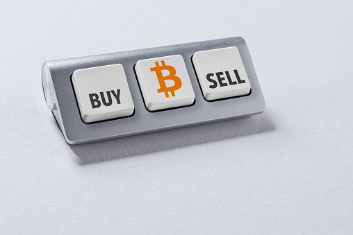 Three buttons computer keyboard. Buy And Sell Bitcoin. Fintech, financial technology concepts.
Trade with crypto currency.