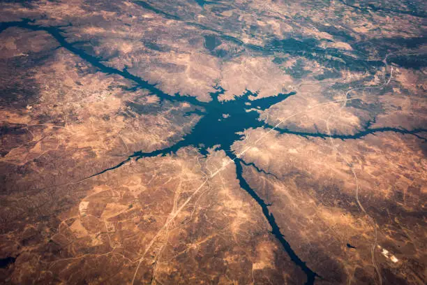 Alcantara reservoir (Embalse de Jose Maria Oriol) on Tagus river. View from the plane above Spain.