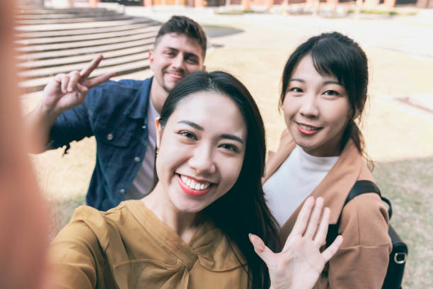 istock Asian student taking selfie in school 1303391903