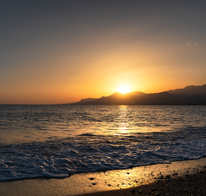 Colorful sunset on Crete island (Greece).