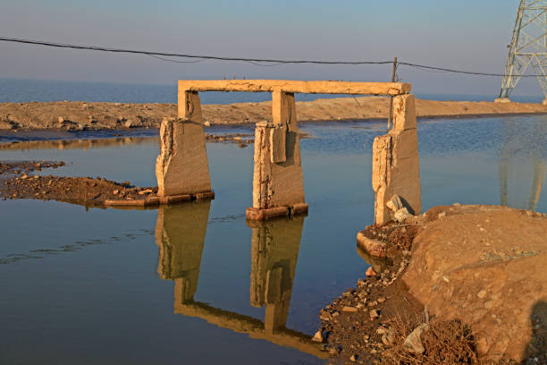 istock River damaged buildings reflected in the water 1303392565