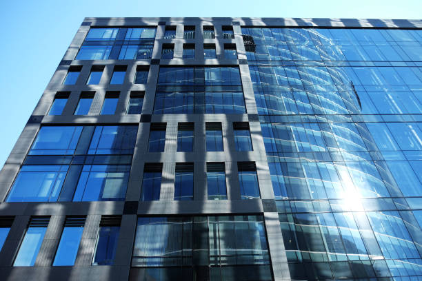 istock modern business center with big glass wnindows 1303394800