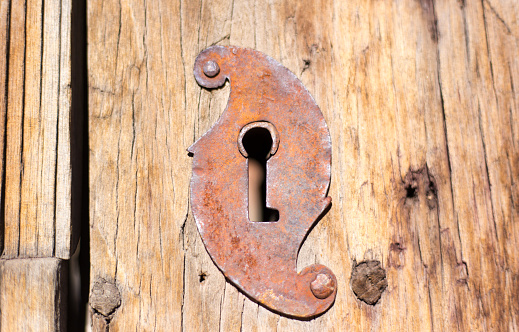 An old slide door lock. Vintage rusty steel.