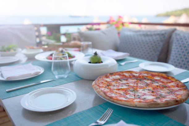 istock Dinner tables near the sea 1303395645