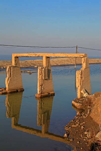 istock River damaged buildings reflected in the water 1303395859