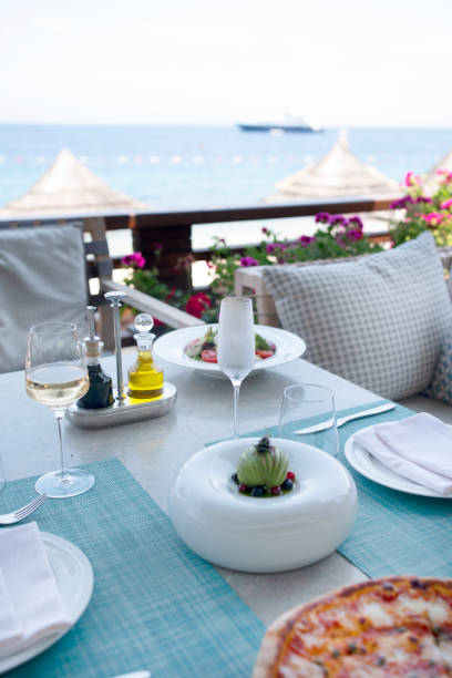 istock Summmertime Dinner tables near the sea 1303395979