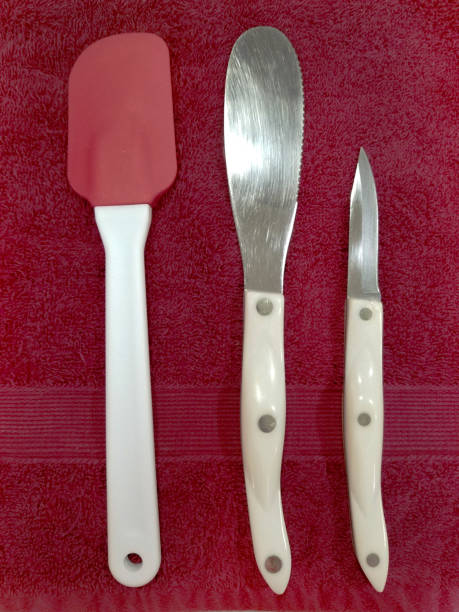 istock Cooking utensils on red tea towel. 1303395989