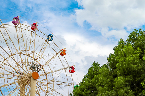 Colorful ferris wheel and blue sky