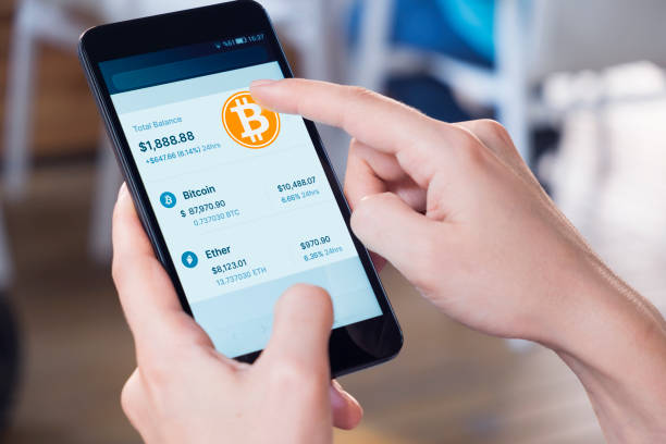 Bitcoin - Crypto Currency Wallet On A mobile Phone Woman using a smart phone displaying a bitcoin wallet screen. bitcoin trading stock pictures, royalty-free photos & images