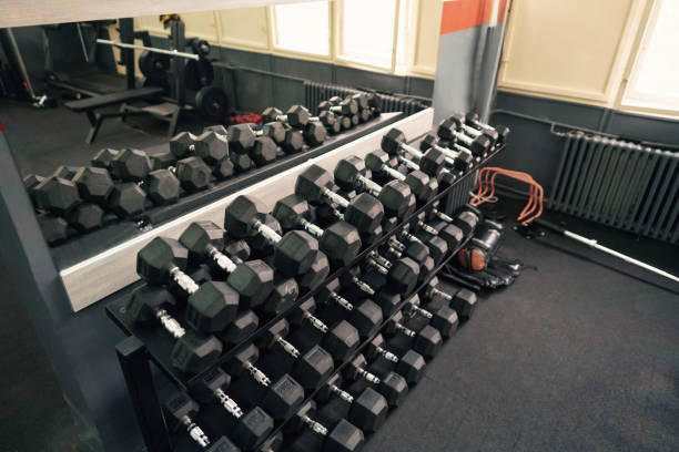 istock Dumbbells on shelf by the mirror 1303402091