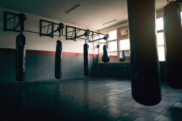 empty gym room with heavy bags - kickboxing imagens e fotografias de stock