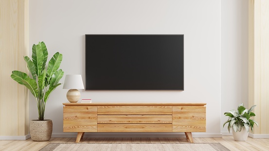 Maqueta una pared de TV montada en una sala de estar con una pared blanca. photo