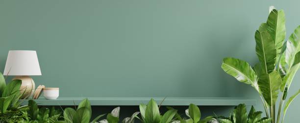 istock Interior wall mockup with green plant,Green wall and shelf. 1303404669