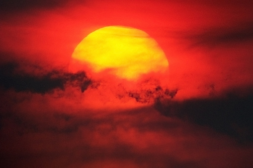 The Sun shines through clouds. Taken using solar filter & telescope.