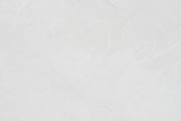 istock White concrete stone surface paint wall background, Grunge cement paint texture backdrop, White rough concrete stone wall background, Copy space for interior design background, banner, wallpaper 1303405423