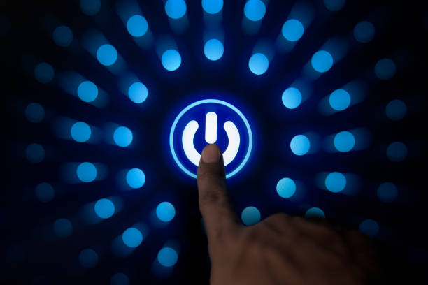 Digitization Idea, Human hand pressing start button to power on the newest technology stock photo