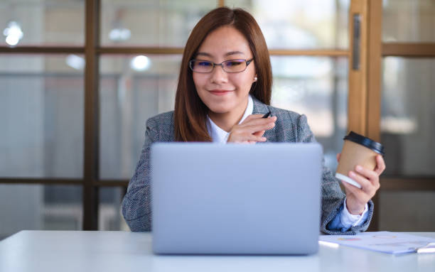 istock a beautiful businesswoman using laptop computer for working online and video conference 1303415330
