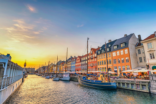 Copenhagen Denmark, sunset city skyline at Nyhavn harbour with colourful house