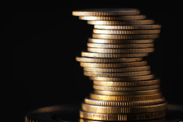 istock stack of coin on table background and business or finance saving money 1303420034