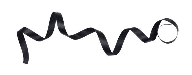 istock Black silk twisted ribbon isolated on white 1303422037