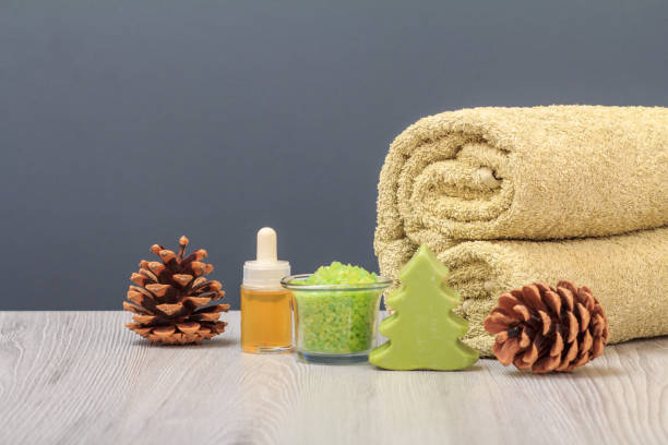 istock Spa composition with soft terry towel and spa products on wooden boards 1303424238