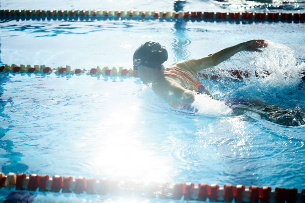 istock Adaptive Athlete swimming and doing the butterfly stroke 1303424372