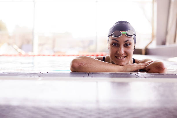 istock Adaptive Athlete swimmer smiling and looking at the camera. 1303424389