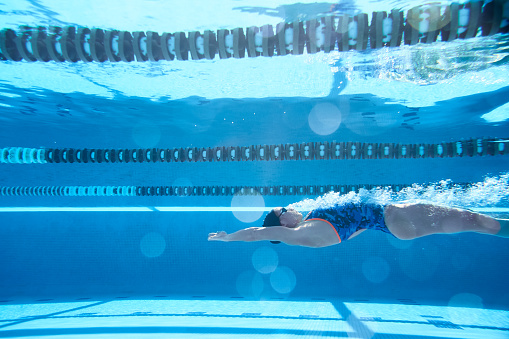 Lifestyle sports and swimming\nAthlete swimmer doing a backstroke start