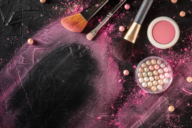 istock Makeup background with brushes, pearls and other products and tools 1303424433